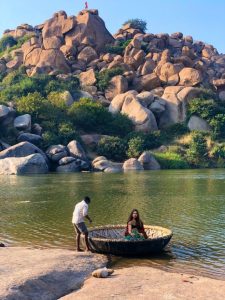 Coracle ride at Sanapur Lake Hampi – traditional round boat experience surrounded by scenic boulders and calm waters