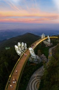 Golden Bridge at Ba Na Hills, Da Nang, Vietnam, held by giant stone hands