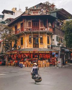 Historic streets of Hanoi Old Quarter, Vietnam, with traditional shops, bustling markets, and colonial architecture